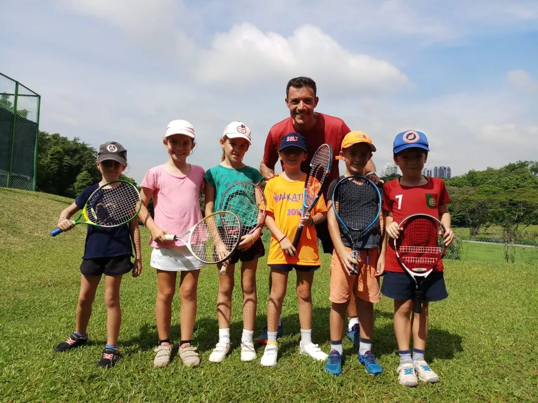 Group photo at a Pure Sport junior holiday tennis camp in Singapore
