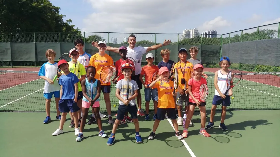 Junior group tennis session with Pure Sport coaches