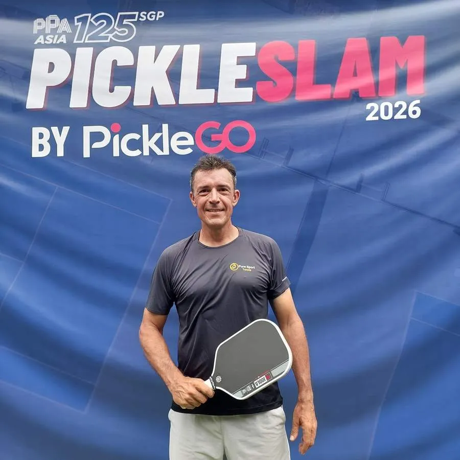 Anthony Claudot with a pickleball paddle at a Singapore tournament