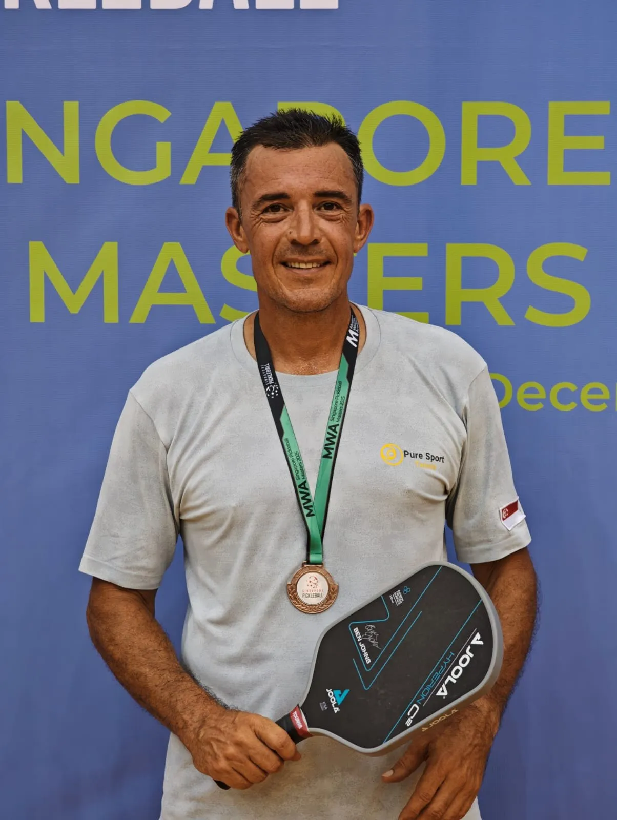 Anthony Claudot with his medal at the Singapore Pickleball Masters