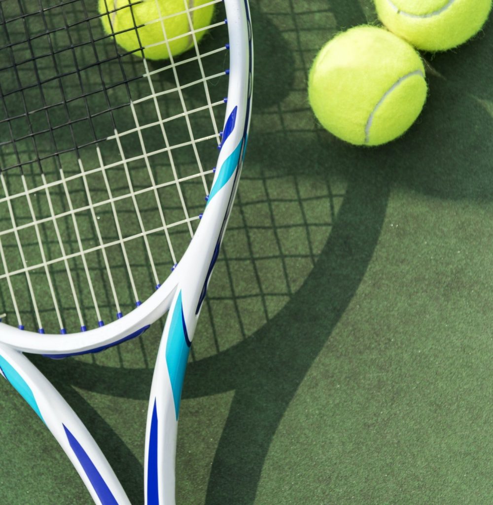 tennis-balls-on-a-tennis-court-1.jpg